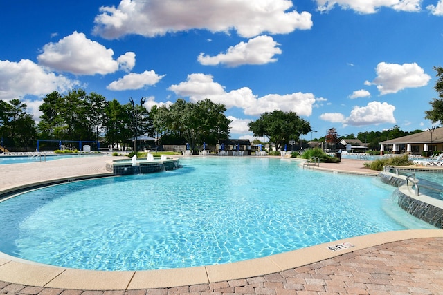 view of swimming pool featuring pool water feature