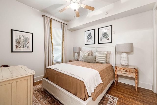 bedroom featuring ceiling fan and dark hardwood / wood-style flooring