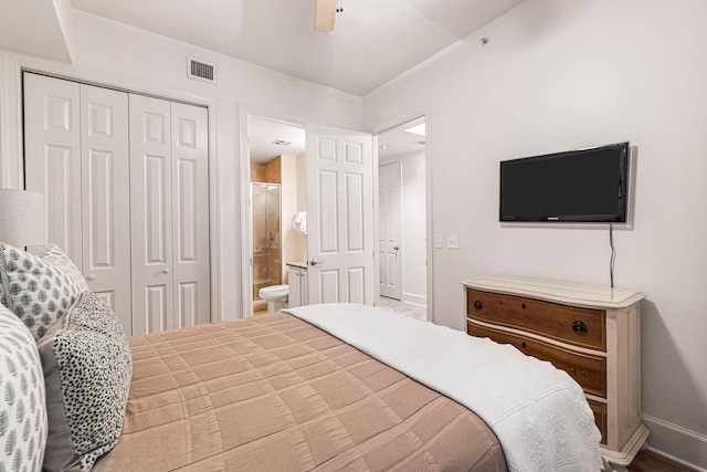 bedroom with ceiling fan, a closet, and ensuite bathroom