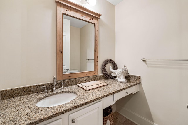 bathroom featuring tile patterned flooring and vanity