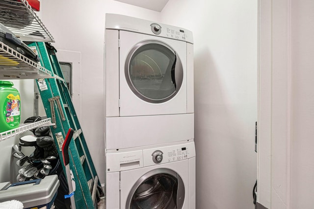 washroom with stacked washer and dryer