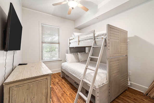 bedroom with ceiling fan and dark hardwood / wood-style floors