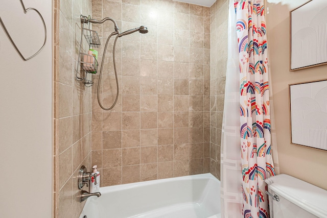 bathroom featuring shower / tub combo with curtain and toilet