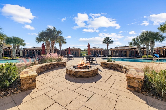 exterior space featuring a gazebo, a patio area, and an outdoor fire pit