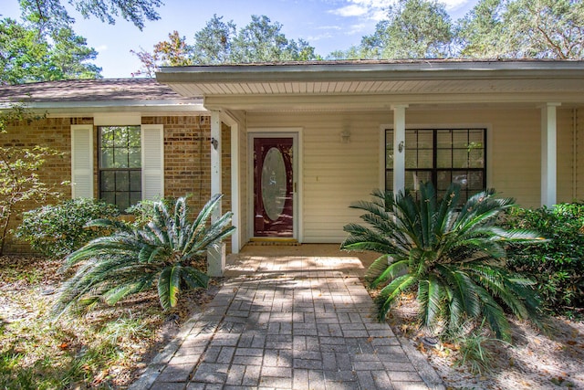 property entrance with covered porch