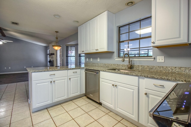 kitchen featuring ceiling fan, sink, stainless steel dishwasher, kitchen peninsula, and white cabinets