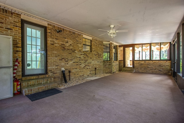 interior space with plenty of natural light and ceiling fan