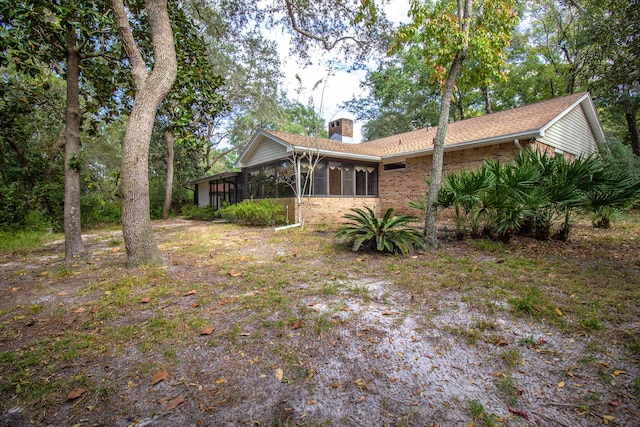 exterior space featuring a sunroom