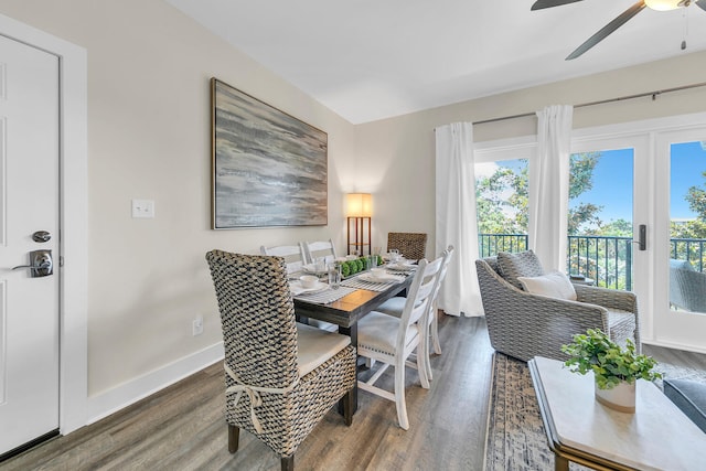 dining space with dark hardwood / wood-style flooring, ceiling fan, and plenty of natural light