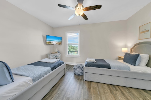 bedroom with ceiling fan and hardwood / wood-style floors