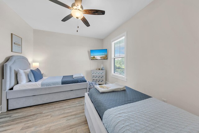 bedroom featuring light wood-type flooring and ceiling fan