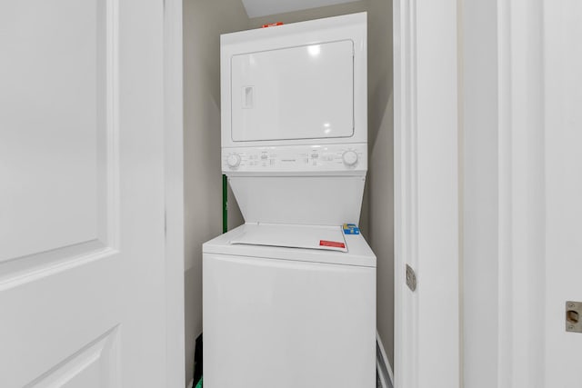 laundry room featuring stacked washer and dryer