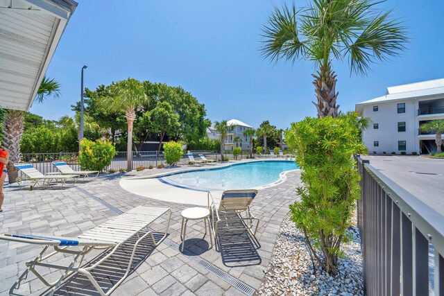 view of pool featuring a patio area