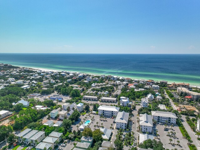 drone / aerial view featuring a water view and a view of the beach