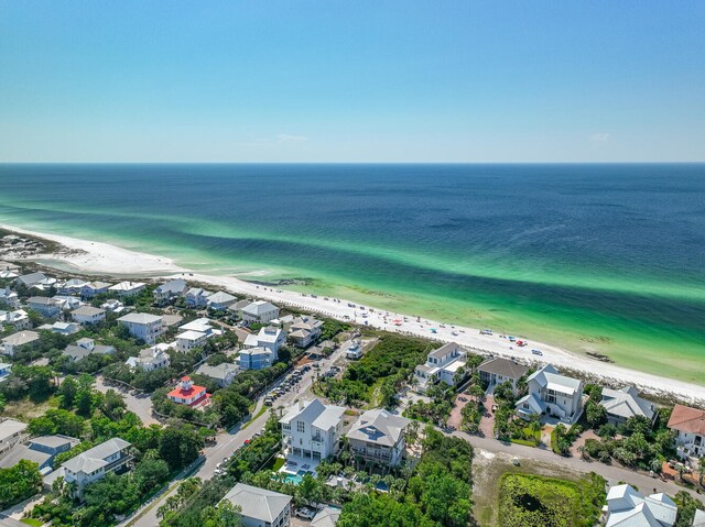 aerial view featuring a view of the beach and a water view