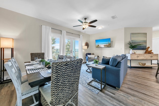 dining area with ceiling fan and hardwood / wood-style floors