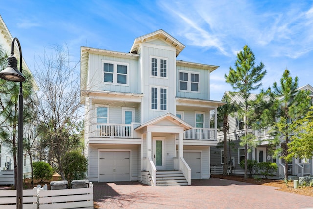 view of front of house with a balcony and a garage