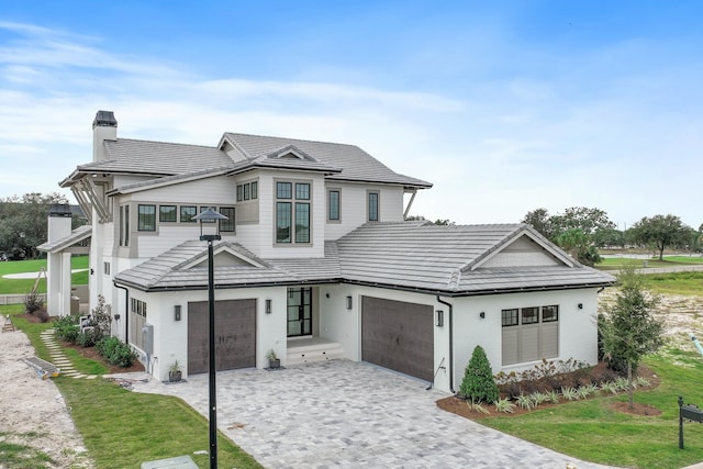 view of front facade with a garage and a front yard