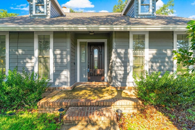 doorway to property featuring a porch