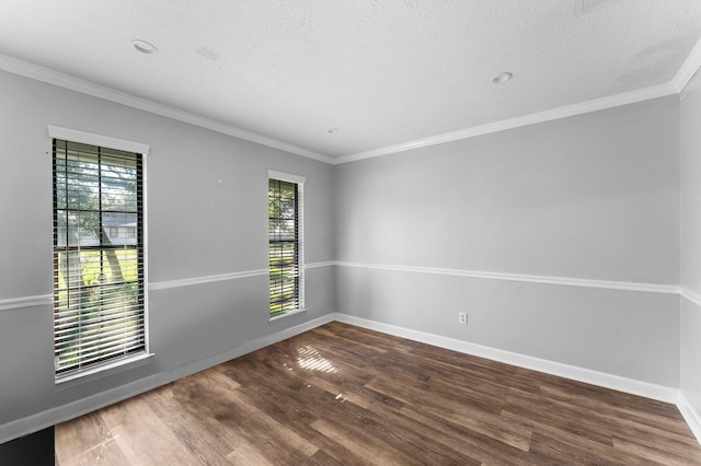 unfurnished room with a textured ceiling, dark hardwood / wood-style floors, and a wealth of natural light