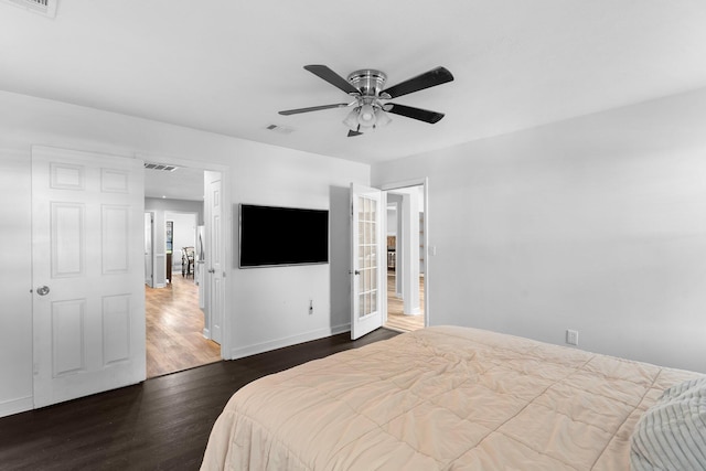 bedroom with ceiling fan and dark hardwood / wood-style floors