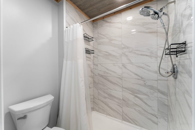 bathroom with walk in shower and toilet