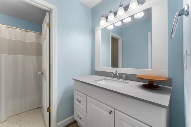 bathroom featuring tile patterned flooring and vanity