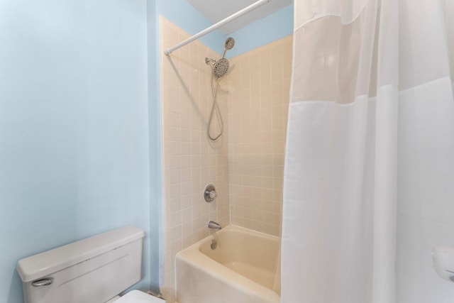 bathroom with toilet and shower / bath combination with curtain