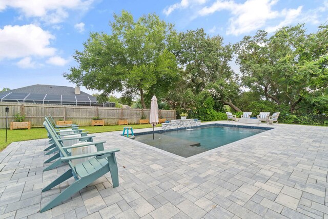 view of swimming pool featuring a patio area