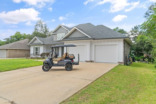 view of front of property with a garage and a front lawn