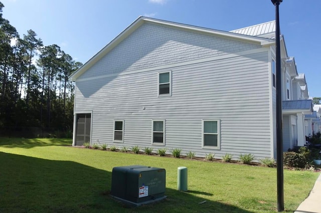 view of property exterior featuring a lawn