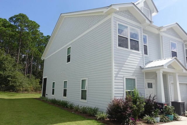 view of home's exterior featuring a lawn