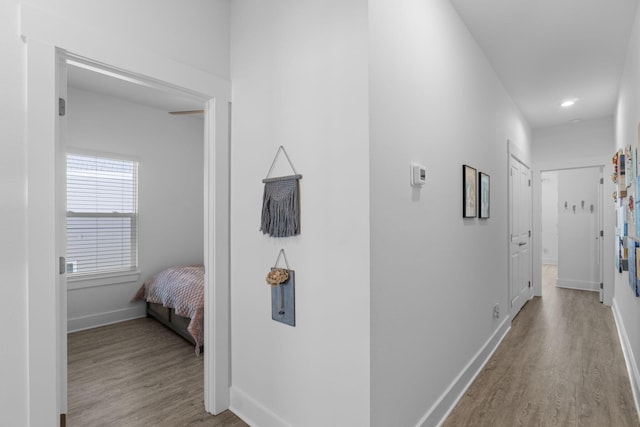 hallway with light wood-type flooring