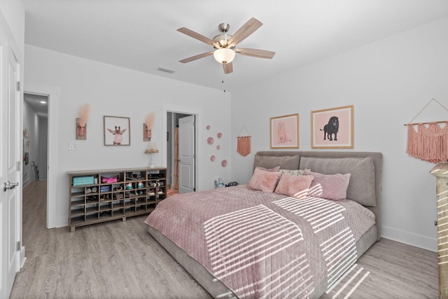 bedroom featuring ceiling fan and light hardwood / wood-style flooring