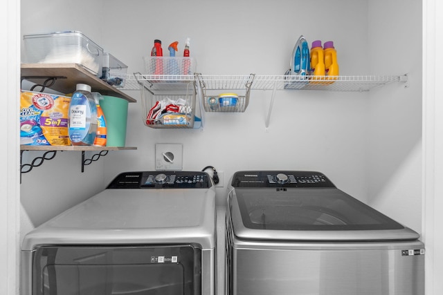 laundry room featuring washing machine and clothes dryer