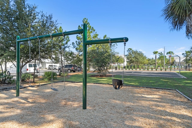 surrounding community with basketball court and a playground