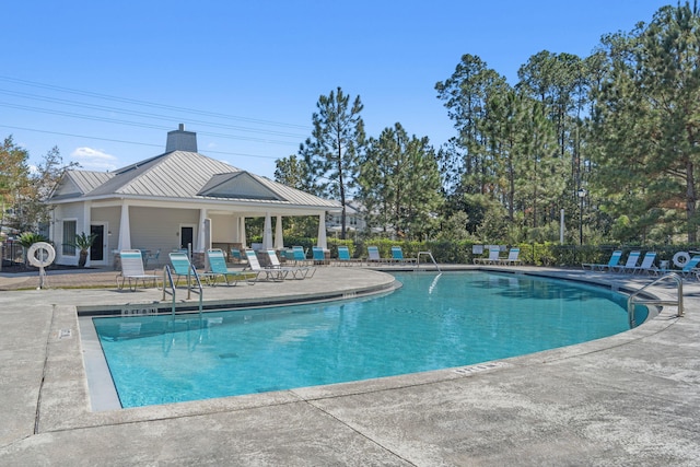 view of swimming pool with a patio area