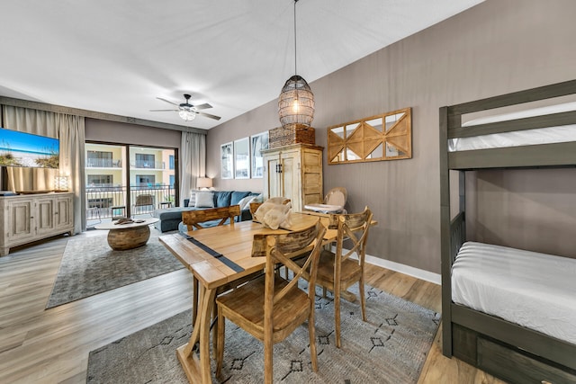 dining room with ceiling fan and light hardwood / wood-style flooring