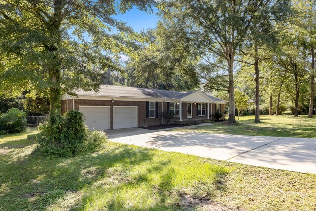 ranch-style house with a front yard and a garage