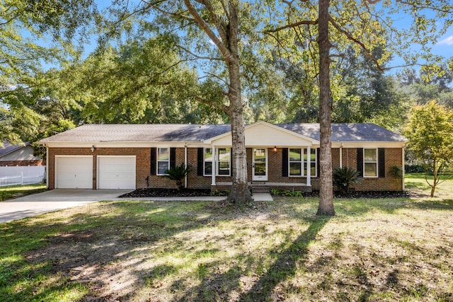 ranch-style home featuring a garage and a front yard