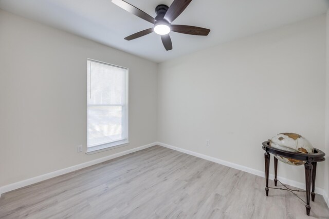 spare room with ceiling fan and light hardwood / wood-style flooring