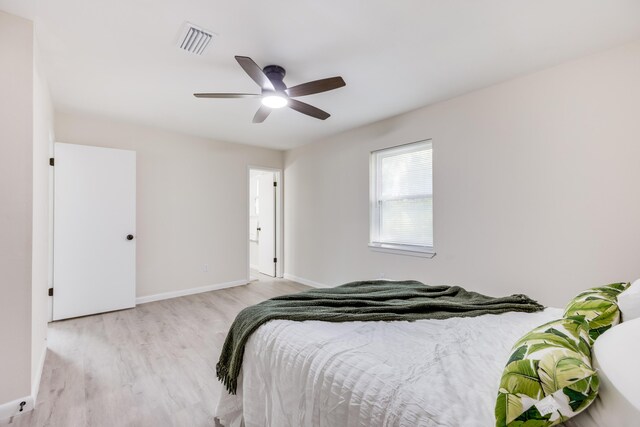 bedroom featuring light hardwood / wood-style floors and ceiling fan