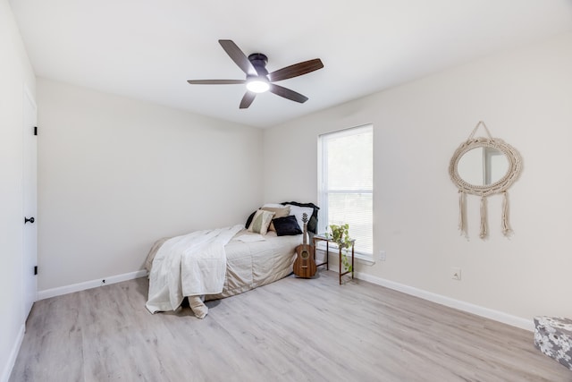 bedroom with ceiling fan and light wood-type flooring