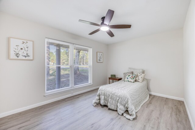 bedroom featuring light hardwood / wood-style flooring and ceiling fan