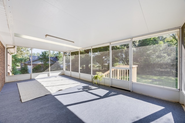 unfurnished sunroom featuring plenty of natural light