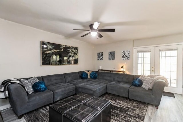 living room with french doors, wood finished floors, and a ceiling fan