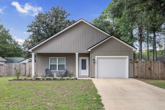 view of front of home featuring a garage and a front lawn