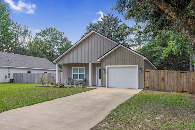 view of front of home with a garage, central air condition unit, and a front lawn