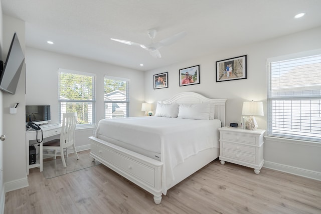 bedroom featuring light hardwood / wood-style floors and ceiling fan