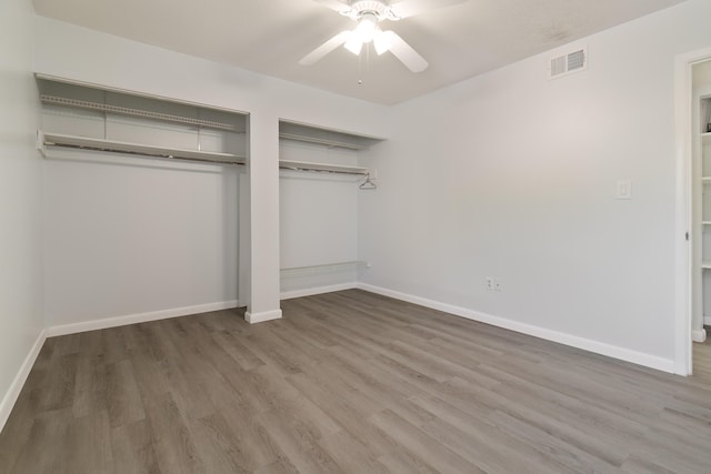 unfurnished bedroom with wood-type flooring and ceiling fan